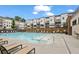 Enjoy the community pool with lounge chairs, umbrellas, and tanning deck for relaxation at 1030 Burnside Nw Pl, Atlanta, GA 30318