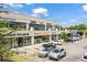 View of shopping center, featuring many stores, ample parking, and well maintained landscaping at 1030 Burnside Nw Pl, Atlanta, GA 30318