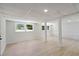 Bright basement with wood-look floors, recessed lighting, and multiple windows at 2158 Oregon Ct, Decatur, GA 30032