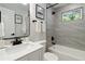 Modern bathroom featuring tiled walls, vanity and tub at 2158 Oregon Ct, Decatur, GA 30032