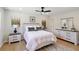 Bright bedroom with a queen bed, white bedding, and wood-look flooring at 2158 Oregon Ct, Decatur, GA 30032
