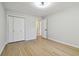 Empty bedroom with closet, neutral walls and wood-look floors at 2158 Oregon Ct, Decatur, GA 30032