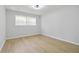 Empty bedroom with neutral walls and wood-look floors at 2158 Oregon Ct, Decatur, GA 30032