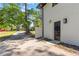 Long driveway leading to a brick home with mature trees and landscaping at 2158 Oregon Ct, Decatur, GA 30032