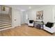 Bright entryway with hardwood floors, a decorative front door, and stylish furnishings at 2158 Oregon Ct, Decatur, GA 30032