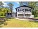 Charming two-story home with painted brick, black shutters, and a well-manicured lawn at 2158 Oregon Ct, Decatur, GA 30032