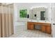 Spacious primary bathroom with double vanity, soaking tub, tile flooring, and separate shower at 3845 Pilgrim Mill Rd, Cumming, GA 30041