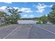 Community boat ramp leading into a scenic lake surrounded by trees under a bright blue sky at 3845 Pilgrim Mill Rd, Cumming, GA 30041