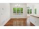 Bright dining area with large windows and hardwood flooring, ideal for Gathering gatherings at 3845 Pilgrim Mill Rd, Cumming, GA 30041