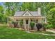 Charming home with a welcoming front porch, lush lawn, and well-maintained landscaping at 3845 Pilgrim Mill Rd, Cumming, GA 30041