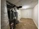 Unfinished basement utility area with HVAC, hot water heater, and cement floors at 1100 Whistle Dr, Austell, GA 30106