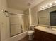 Standard bathroom with shower-tub combo, white toilet, and oak vanity at 1100 Whistle Dr, Austell, GA 30106