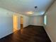 Bedroom with hardwood floors, and one window overlooking the outside at 1100 Whistle Dr, Austell, GA 30106