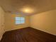 Bedroom featuring hardwood floors, and a window with blinds at 1100 Whistle Dr, Austell, GA 30106