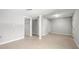 Open basement with tile flooring, support beams, and a walk-in closet with wire shelving at 1505 Cedar Bluff Trl, Marietta, GA 30062