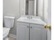 Cozy bathroom with neutral colors, a standard toilet, and a single sink vanity at 1505 Cedar Bluff Trl, Marietta, GA 30062
