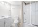 Updated bathroom featuring a white vanity, toilet, and a walk-in shower with sliding glass doors at 1505 Cedar Bluff Trl, Marietta, GA 30062