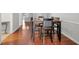 Dining area with hardwood floors and modern black chairs and table perfect for entertaining at 1505 Cedar Bluff Trl, Marietta, GA 30062