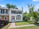 Inviting two-story townhouse with dark shutters, freshly painted white exterior and a lovely green lawn at 1505 Cedar Bluff Trl, Marietta, GA 30062