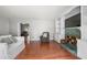 Inviting living room with hardwood floors, a tiled fireplace and built-in shelving for ample storage at 1505 Cedar Bluff Trl, Marietta, GA 30062