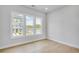 Bright bedroom featuring large windows, hardwood floors, and ample natural light at 2611 Alcovy Ne Trl, Marietta, GA 30066