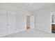 Spacious main bedroom with closet and bathroom access, and an overhead ceiling light at 2611 Alcovy Ne Trl, Marietta, GA 30066