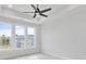 Light-filled main bedroom with a ceiling fan, and large windows showing community view at 2611 Alcovy Ne Trl, Marietta, GA 30066