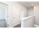 Bright hallway with neutral walls and carpet, leading to several rooms at 2731 Stream Valley Lane Nw Nw Cir, Atlanta, GA 30318