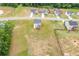 Aerial view of a home nestled in a serene neighborhood, highlighting its spacious yard and proximity to lush greenery at 294 Ralph Still Rd, Dacula, GA 30019