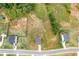 Aerial view of multiple homes in a neighborhood with trees at 294 Ralph Still Rd, Dacula, GA 30019