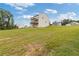 Exterior shot of a two-story home with a large grassy backyard and covered back porch at 294 Ralph Still Rd, Dacula, GA 30019