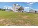 Large backyard with lush green grass and a view of the two-story home at 294 Ralph Still Rd, Dacula, GA 30019