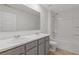 Bright bathroom featuring double sinks and tub with shower at 294 Ralph Still Rd, Dacula, GA 30019
