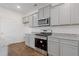 Modern kitchen with stainless steel appliances, granite countertops and plenty of cabinet space at 294 Ralph Still Rd, Dacula, GA 30019
