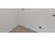 Laundry room features hook ups for washer/dryer and vinyl flooring at 294 Ralph Still Rd, Dacula, GA 30019