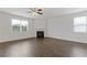 Living room featuring a fireplace, ceiling fan and natural light at 294 Ralph Still Rd, Dacula, GA 30019