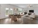 Bright living room featuring modern furniture, fireplace, and view of the deck at 294 Ralph Still Rd, Dacula, GA 30019