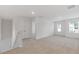 Upstairs loft featuring neutral carpet and plenty of natural light at 294 Ralph Still Rd, Dacula, GA 30019