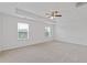 Spacious main bedroom features a tray ceiling, ceiling fan, and plenty of natural light from two windows at 294 Ralph Still Rd, Dacula, GA 30019