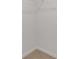 Unfinished walk-in closet featuring wire shelving and neutral carpet at 294 Ralph Still Rd, Dacula, GA 30019