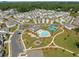 An aerial view of the community showcasing a pool, tennis courts, and playground nestled among charming homes at 3723 Silvery Way, Powder Springs, GA 30127