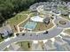 A beautiful aerial view of the community showing the pool, tennis courts, and roundabout at 3723 Silvery Way, Powder Springs, GA 30127