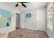 Bright bedroom with gray walls, plush carpet, ceiling fan, and a cute wall design at 3723 Silvery Way, Powder Springs, GA 30127