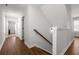 Hallway with hardwood floors and stairway at 3723 Silvery Way, Powder Springs, GA 30127