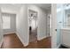 Hallway with hardwood floors, leading to a bedroom and bathroom at 3723 Silvery Way, Powder Springs, GA 30127