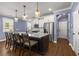 Stylish kitchen island with seating and modern pendant lighting at 3723 Silvery Way, Powder Springs, GA 30127