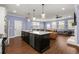 Spacious kitchen open to a naturally lit living area at 3723 Silvery Way, Powder Springs, GA 30127