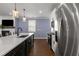 Modern kitchen overlooks living room with fireplace at 3723 Silvery Way, Powder Springs, GA 30127