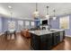 Open concept living room and kitchen perfect for entertaining at 3723 Silvery Way, Powder Springs, GA 30127
