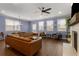 Bright living room with hardwood floors, a fireplace, and large windows providing ample natural light at 3723 Silvery Way, Powder Springs, GA 30127